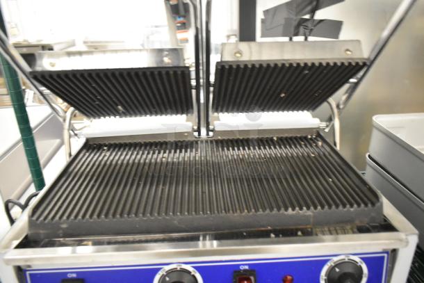 BRAND NEW Globe stainless steel double panini press, countertop model, slight scratches, commercial-grade, with ribbed plates.