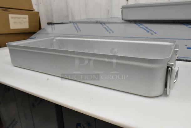Brand new Aesculap JN440 metal bin, scratch and dent condition, rectangular with secure latch, ideal for storage.