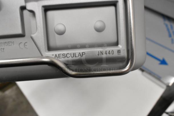 Aesculap JN440 metal bin, brand new with minor scratches and dents, displaying label for model verification.