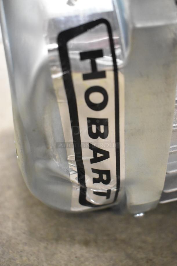 BRAND NEW Hobart FD4/125-1 Commercial Garbage Disposer, 1 1/4 hp, scratch and dent condition, visible Hobart label.