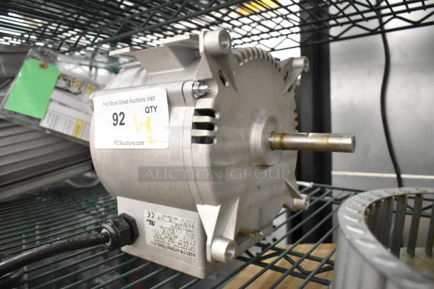 Brand new Nidec motor, 208-240V, 1 phase, with minor scratches, visible label "92 QTY," on metal shelving.