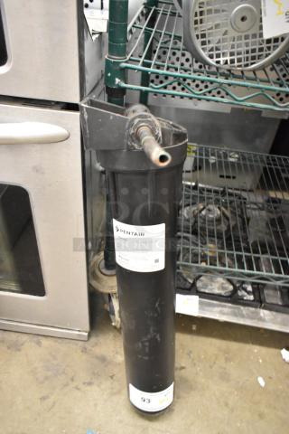 BRAND NEW Pentair Everpure E Series Water Filter with minor scratches. Black cylinder design, labeled for effective filtering.