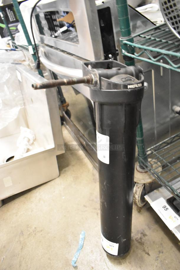 Brand new Pentair Everpure E Series water filter, scratch and dent condition, black housing with visible labels.