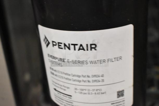 Brand new Pentair Everpure E-Series water filter, scratch and dent condition, labeled with cartridge part numbers.