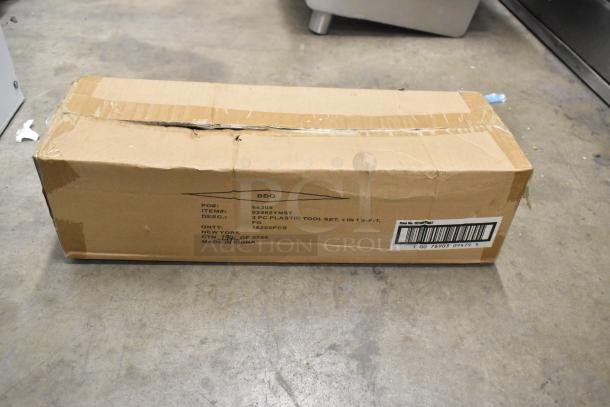 Cardboard box labeled with "02465YNST" containing six brand new Mr. Bar-B-Q 3-piece BBQ tool sets. Box shows minor wear.