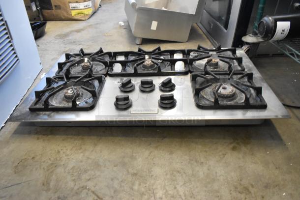 Frigidaire PLGC36S9CCB gas range with 5 burners, used condition, stainless steel, visible control knobs and brand label.