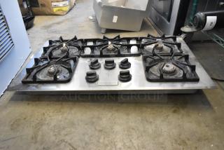 Frigidaire PLGC36S9CCB gas range with 5 burners, used condition, stainless steel, visible control knobs and brand label.