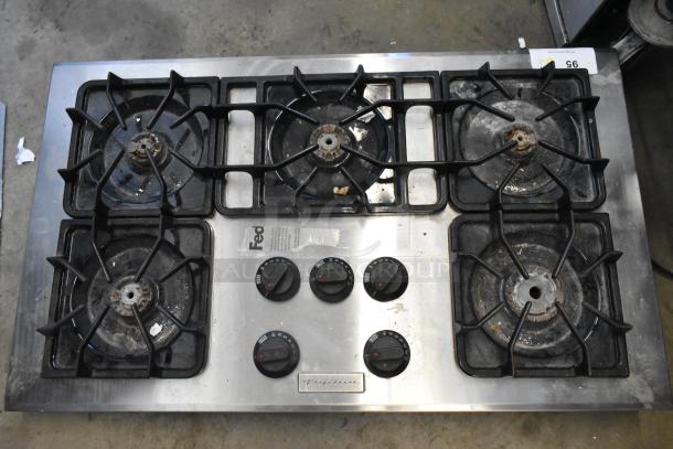 Frigidaire PLGC36S9CCB gas range, 5 burners, used condition, visible control knobs and brand logo, metal surface.