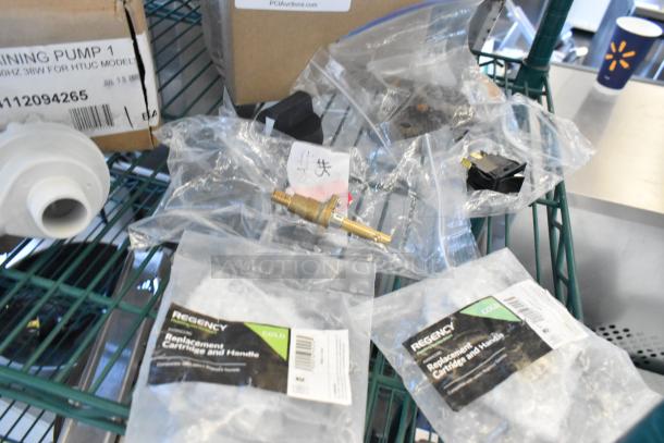 Brand new MainStreet Equipment draining pump and Regency cold faucet body, both in original packaging.