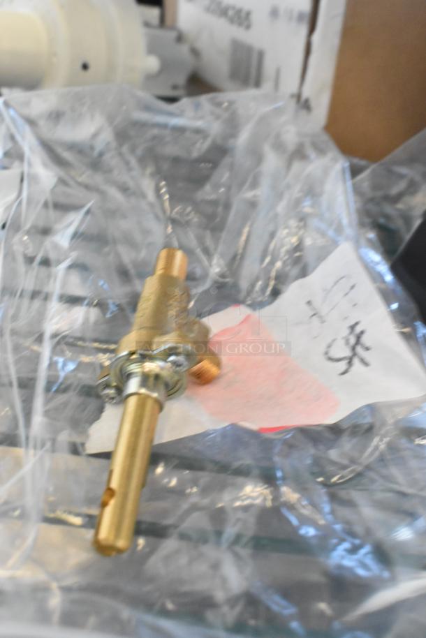Brand new Regency 600HCCRD cold faucet body with handle, sealed in packaging. Includes MainStreet Equipment draining pump.