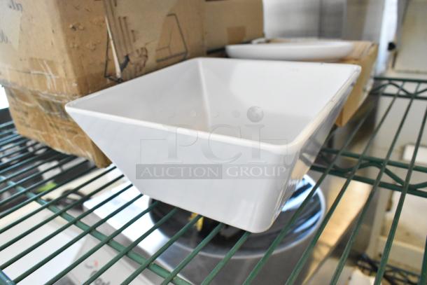5 brand new scratch and dent items, featuring Acopa Rittenhouse 50 oz. square white melamine bowl and American Metalcraft Ani 6 1/4" white round melamine coupe plate.