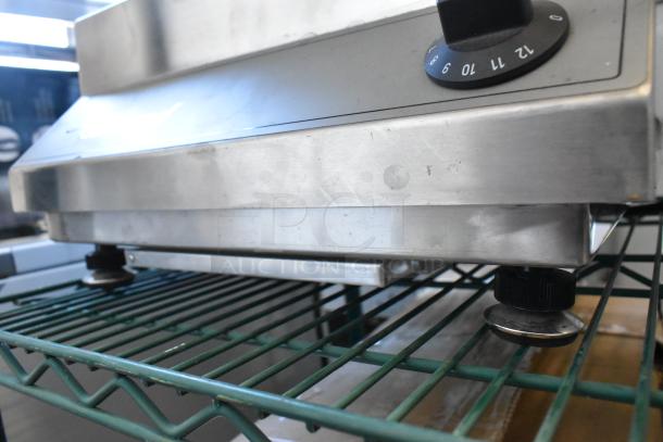 Garland SH/WO 3500 stainless steel single burner wok induction range on metal rack, electric, 208V, 1 phase, good condition.