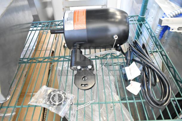 BRAND NEW SCRATCH AND DENT! VF-30WLF0 Boltic 30" oscillating fan motor, 120 volts, 1 phase, with tags and power cord visible.