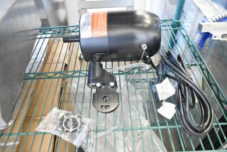 BRAND NEW SCRATCH AND DENT! VF-30WLF0 Boltic 30" oscillating fan motor, 120 volts, 1 phase, with tags and power cord visible.