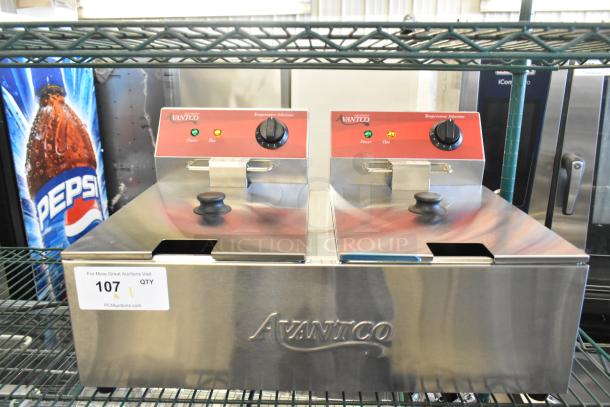 Brand new Avantco 177F102 stainless steel dual tank electric fryer, 20 lb. capacity, 120V, 1 phase, with 2 metal lids.