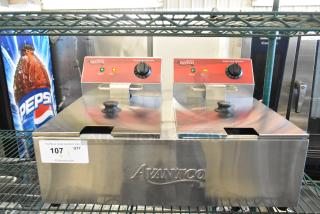 Brand new Avantco 177F102 stainless steel dual tank electric fryer, 20 lb. capacity, 120V, 1 phase, with 2 metal lids.