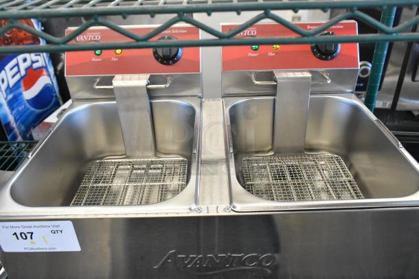 Brand new Avantco 177F102 dual tank electric fryer, 20 lb capacity, stainless steel, 120V, includes 2 metal lids.