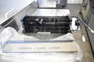 Brand new Avantco 17818115 evaporator coil for 27" AU/AWT series, slight scratches, American Range A17095 marking visible.