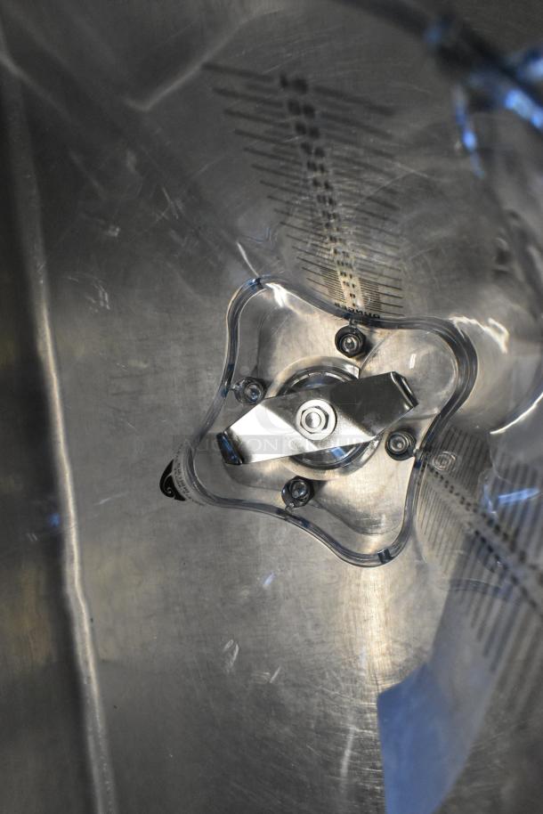 Brand new clear poly blender pitcher, scratch and dent, with measurement markings and sturdy stainless steel blades.