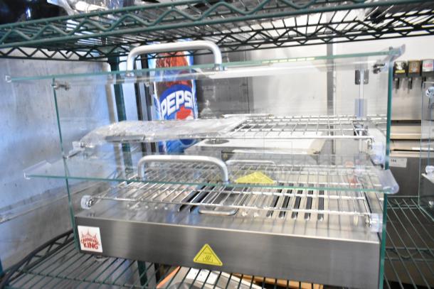 Brand new Carnival King 382HDSG2A hot food display case, silver, glass, 2 shelves, 120 volts, minor scratches.