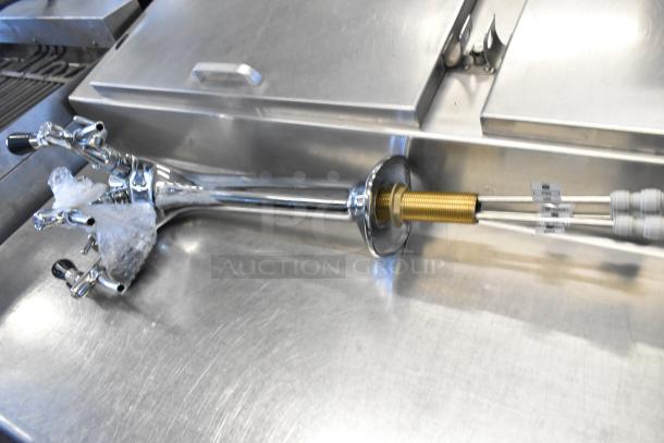 Three brand new scratch and dent items, including Hatco RMB-7M Control Box and Avantco 177PMX60HIAX Axle Assembly, on a metal surface.