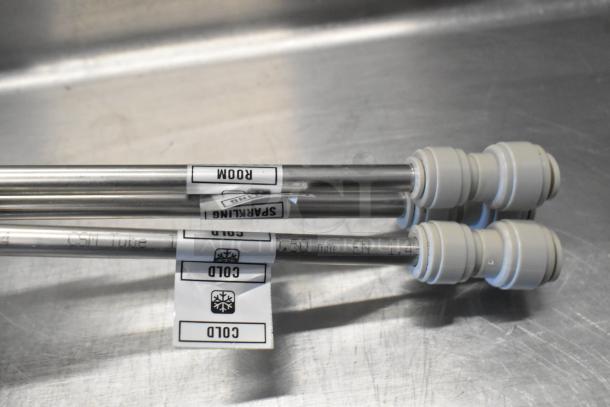 Three stainless steel tubes with labeled tags indicating "ROOM," "SPARKLING," and "COLD," each featuring plastic connectors.