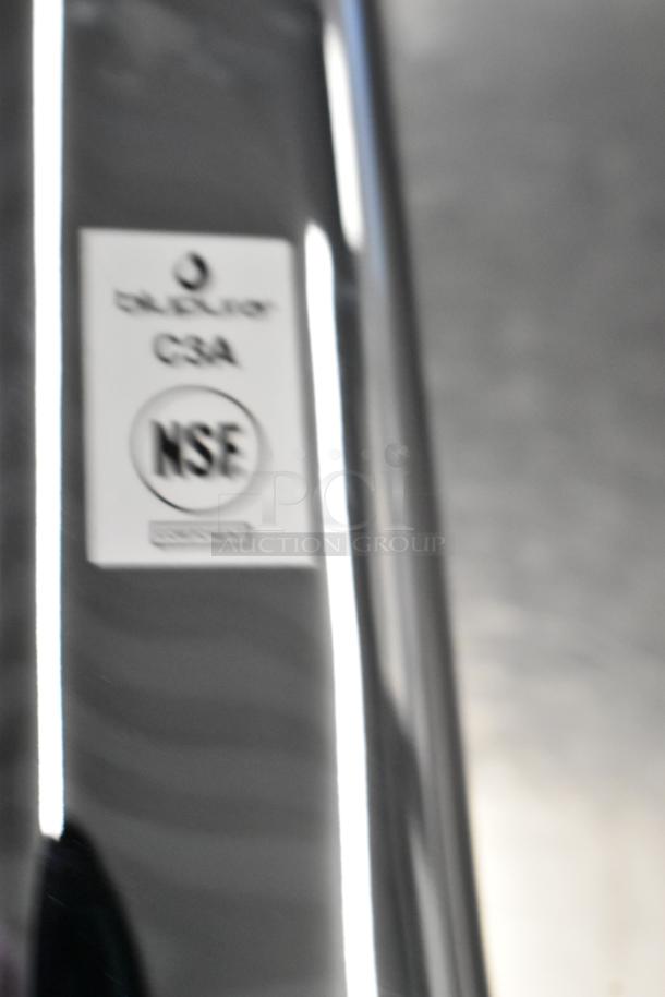 NSF certified metal surface with a blurry label "C3A NSF." Image unrelated to auction item description.