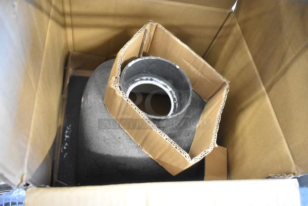 Zurn JP2375-P03 single drain in a cardboard box, shown with protective packaging. Drain appears to be new.