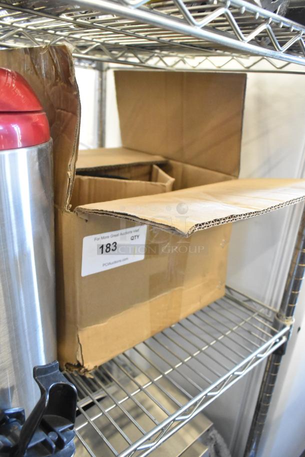 Cardboard box labeled with "183" on a metal shelf. Contains Zurn JP2375-P03 Single Drain. Box appears slightly worn.