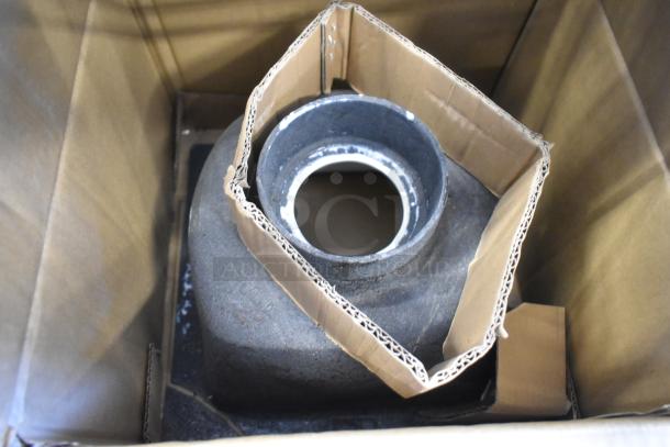 Zurn JP2375-P03 single drain in cardboard packaging, condition appears unused. Metal construction with visible white inner lining.