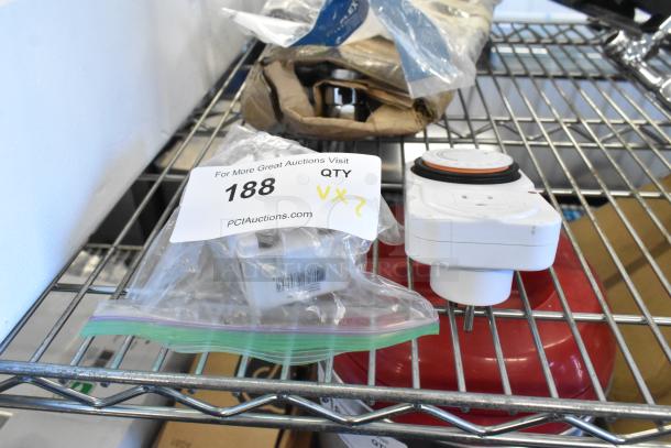 Two items: Tanda TS-MU3 grounded outlet timer and Honeywell K10145WH Class II transformer in bags, on a shelf. Auction lot 188.