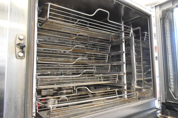 Stainless steel interior of Rational iCombiPro electric convection oven, showing racks for parts; 440/480V, 3-phase.