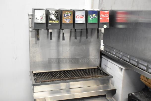 Stainless steel 6 flavor soda dispenser on ice bin. Brands: Root Beer, Minute Maid, Fanta, Diet Coke, Sprite, Coca-Cola. 115V.