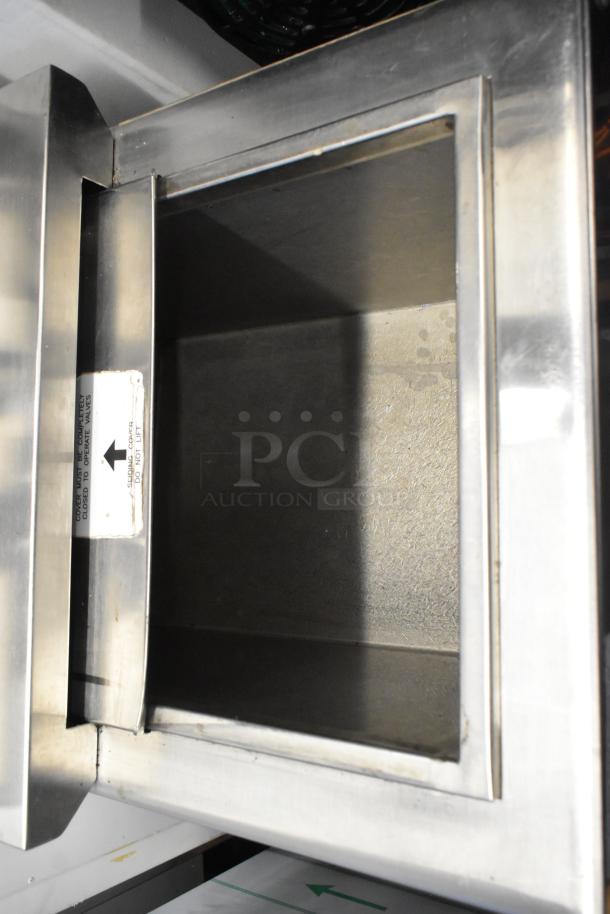 Stainless steel commercial 6 flavor carbonated beverage machine on ice bin, 115 volts, 1 phase; appears in good condition.