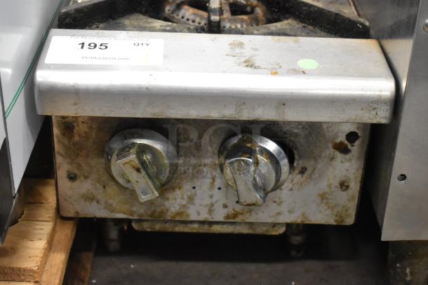 Stainless steel commercial gas-powered 2 burner range, countertop model, showing dual control knobs, used condition.