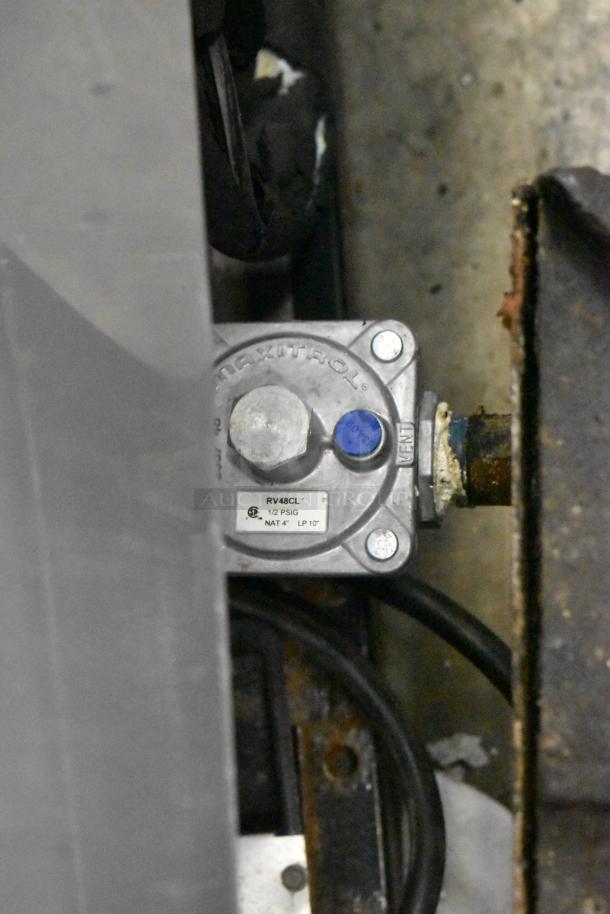 Stainless steel commercial countertop gas-powered 2 burner range with visible valve and Maxitrol label.