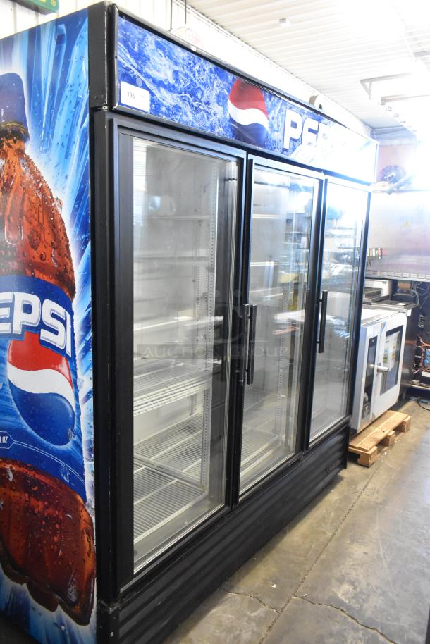 True GDM-72 metal commercial 3-door cooler, Pepsi branding, poly-coated racks, 115 volts, 1 phase, clean condition.