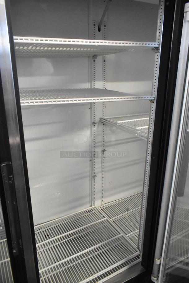 True GDM-72 commercial 3-door cooler, metal construction, poly coated racks, 115V, 1 phase, clean condition.