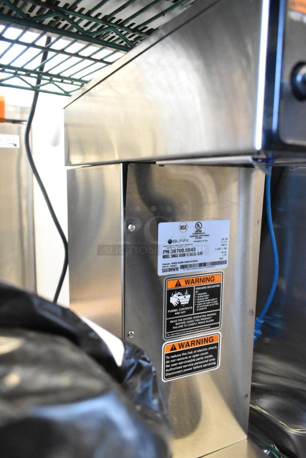 2024 Bunn SINGLE AXIOM 15 stainless steel commercial coffee brewer, 1 gallon capacity, labels indicate caution and model details.