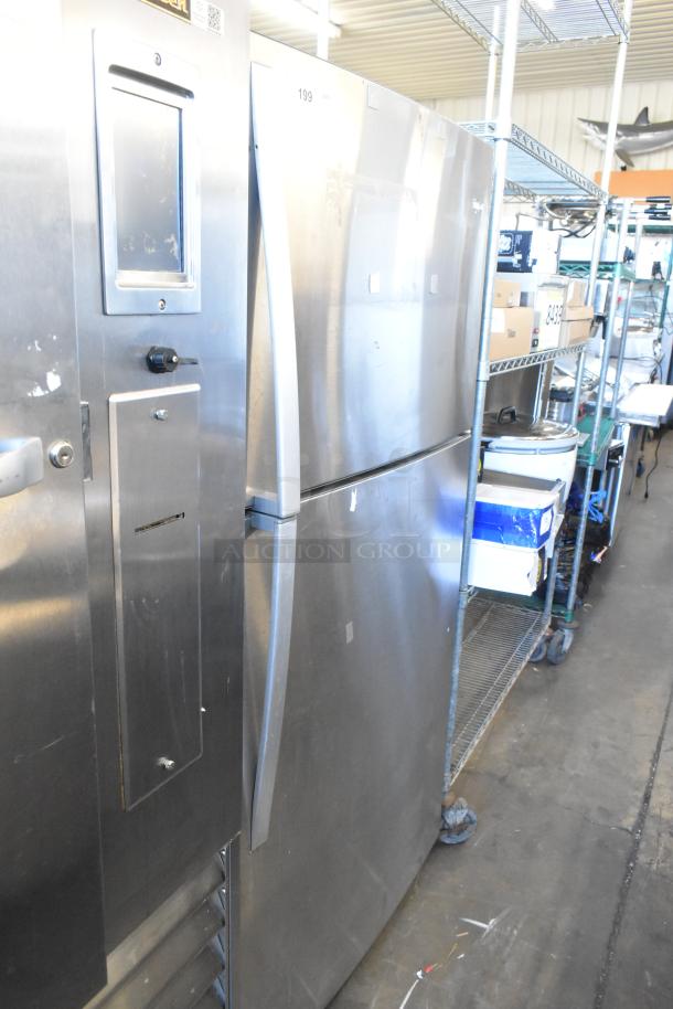 Whirlpool WRT511SZDM00 stainless steel fridge with freezer, 115V, 1 phase. Good condition. Top-freezer design.