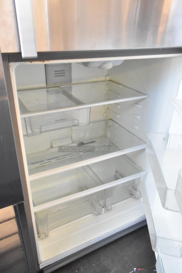 Whirlpool WRT511SZDM00 stainless steel cooler with freezer, 115 volts, 1 phase, open showing shelves and bins.