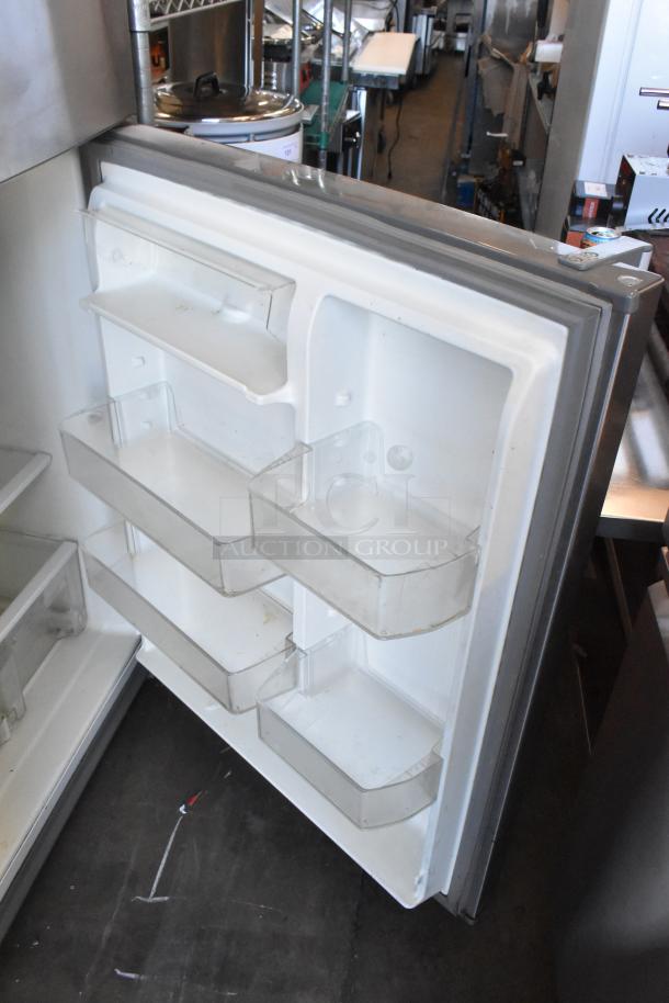 Whirlpool WRT511SZDM00 stainless steel cooler with freezer, clean interior, door shelves, 115 volts, 1 phase.