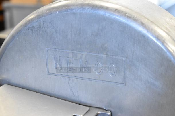 Nemco metal countertop vegetable slicer on mount, showing brand stamp, durable design, used condition.