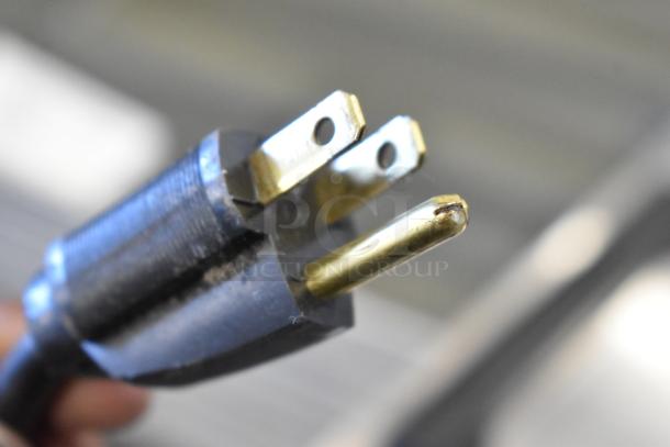 Close-up of an electrical plug for the 2020 Bunn 2SH STAND Stainless Steel Countertop Double Server Stand.