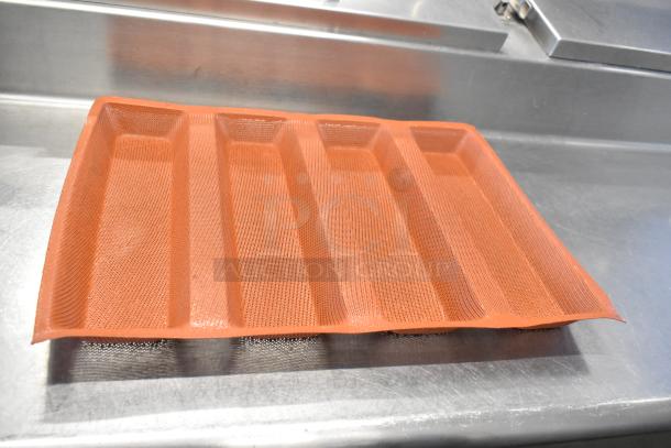 62 various baking pan liners, orange silicone, featuring 4-loaf design. Durable, non-stick surface for baking.