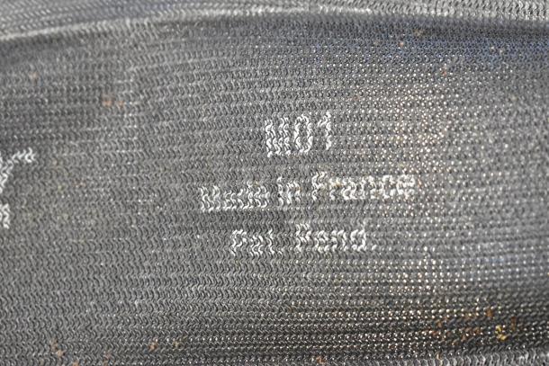 Black baking pan liner with texture. Markings read: "#101," "Made in France," "Pat. Pend."