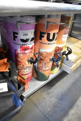 Three Bunn TDO-N-3.5 stainless steel iced tea dispensers, vibrant graphics, labeled for raspberry, unsweetened tea, and half iced tea.