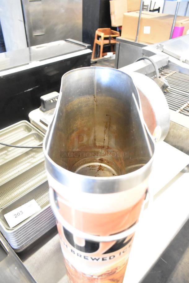Three Bunn TDO-N-3.5 stainless steel iced tea dispensers, used condition, with visible inside wear.