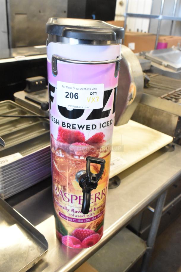 3 Bunn TDO-N-3.5 stainless steel iced tea dispensers with raspberry design, tap, and auction label, in good condition.