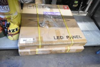 Two brand new LED panel lights in sealed boxes. Boxes marked "LED Panel" with auction label indicating quantity two.